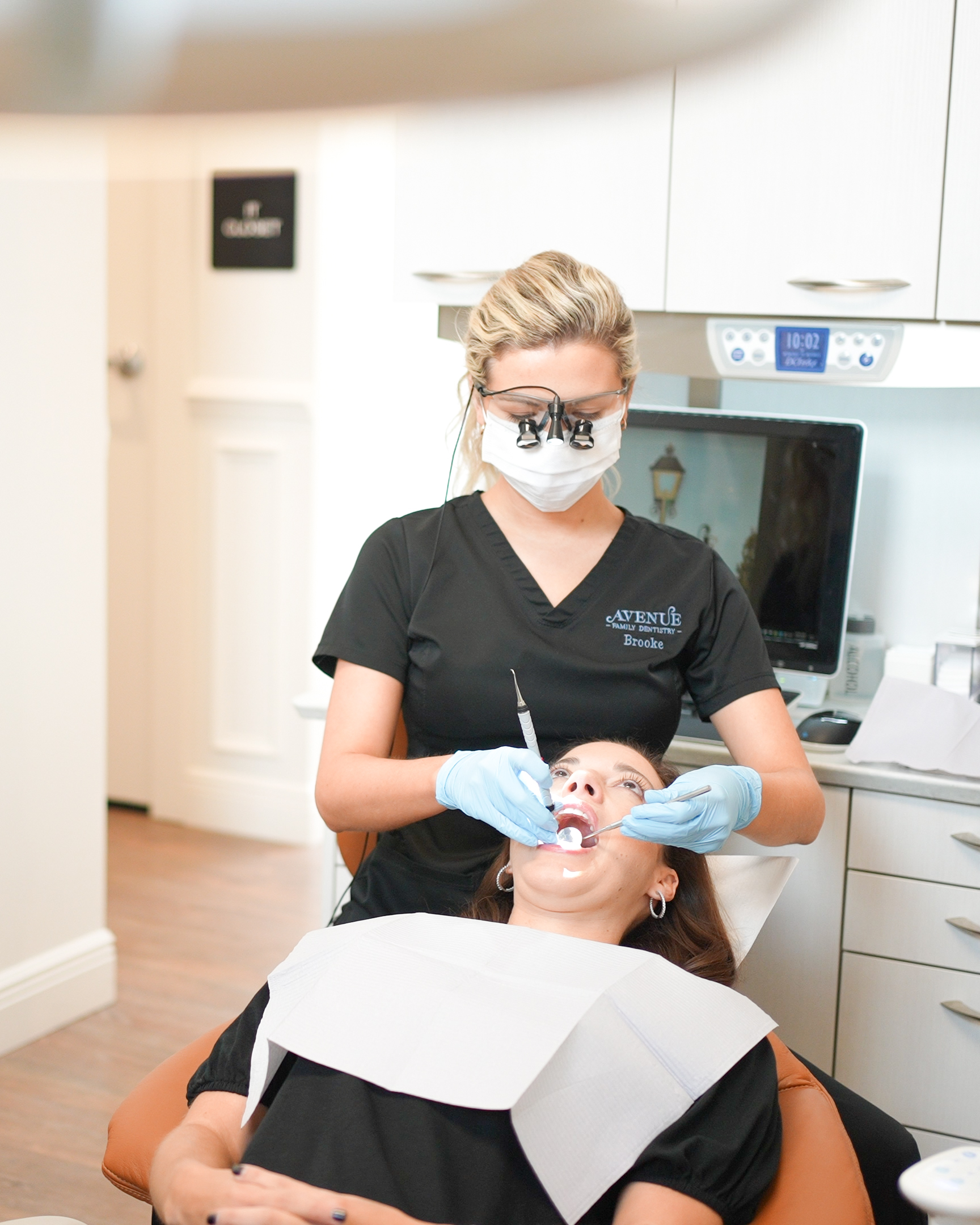 Dentist treating a female patient